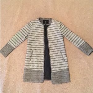 Mid hip length black and white coat